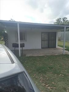 a white house with a car parked in front of it at Ruben Punta Negra in Punta Colorada