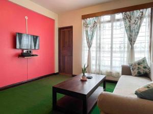 Et tv og/eller underholdning på Crimson Apartment