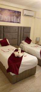 A bed or beds in a room at Amman La Maison Hotel Suites