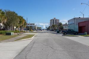 an empty street in a city with cars parked at Cozy Studio - Blocks from the Ocean! in Jacksonville Beach