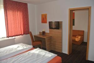TV a/nebo společenská místnost v ubytování Hotel Art-Ambiente