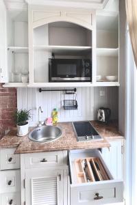 Nhà bếp/bếp nhỏ tại HOME by FLATTO APARTMENT