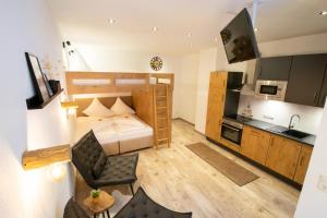 a small apartment with a bed and a kitchen at W-Spirit Apartments in Jerzens