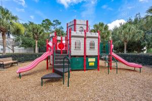 a playground with a slide in a park at Windsor Hills Resort- 402F in Orlando