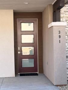 a brown door in a building with a number on it at Water Canyon 4bd3Bath HotTubDeck in Hildale