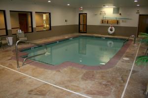 a swimming pool in a hotel room with at Baymont by Wyndham Portage in Portage