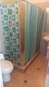 a shower curtain in a bathroom with a toilet at Gran Hotel in Arequipa +85 photos