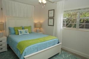 a bedroom with a bed and a window at NEW! 219 Garfield Ave in Cocoa Beach