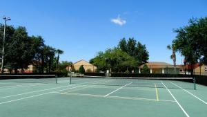 a tennis court with two tennis rackets on it at Windsor Hills Resort- 401 in Orlando