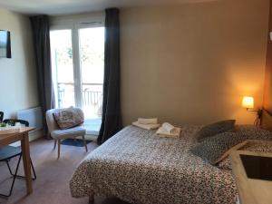 Postel nebo postele na pokoji v ubytování La Féclaz Ski aux pieds Grand Studio Tout confort