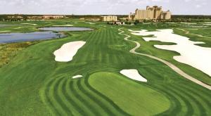 an aerial view of a golf course with water at ChampionsGate- 1565 Four Bedroom Townhouse, Private Pool! in Davenport