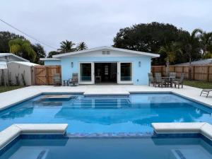 a swimming pool in front of a house at 213 Grant Ave in Cocoa Beach