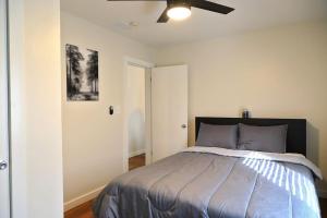 a bedroom with a bed and a ceiling fan at Entire Atlanta Condo Minutes from Downtown in Atlanta