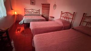 Voodi või voodid majutusasutuse Pirca Hostal toas