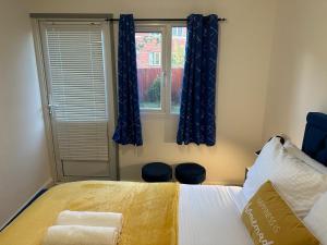 Krevet ili kreveti u jedinici u okviru objekta Cosy Stay In Birmingham by Villazu