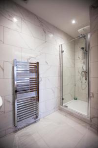 a bathroom with a shower with a glass door at Luxury House in Clitheroe in Clitheroe
