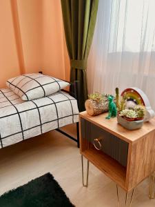 a bedroom with two beds and a table with a toy at Chic& cosy house with Kars Panorama in Kars