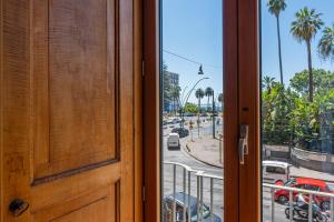 an open door with a view of a city street at Corte Satriano Residence in Naples