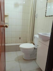 a bathroom with a toilet and a sink at Cabana con Vista al Mar in La Bocana