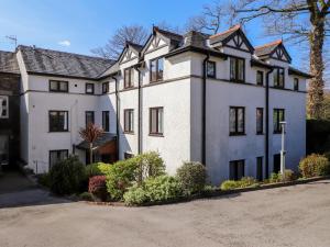 a large white house with a lot of windows at Ambleside Haven in Ambleside