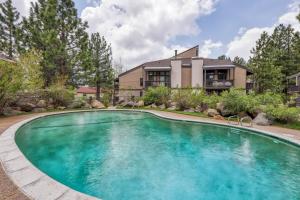 a swimming pool in front of a house at Sherwin Villas 12 B in Mammoth Lakes