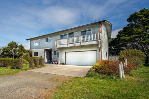 a large house with a garage at Ocean Aire in Bandon