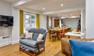a living room with a chair and a table at Wynford in Ambleside