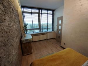 Posteľ alebo postele v izbe v ubytovaní Apartamenty A&B Gold