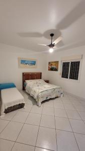 Cama o camas de una habitación en Casa de Praia em Palmas