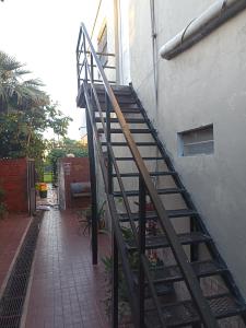 a set of stairs next to a building at Departamentos Temporarios Aeropuerto in Formosa