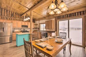 a dining room with a table and chairs and a kitchen at Picturesque Cabin Less Than 1 Mi to Yellowstone River in Livingston
