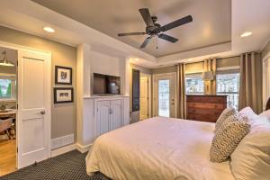 a bedroom with a bed and a ceiling fan at Luxe Lyndon Home Less Than 11 Mi to Dtwn Louisville! in Louisville