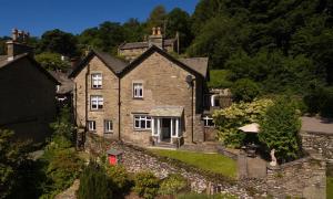 an aerial view of a large stone house at Thyme Out in Troutbeck