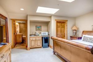 a bedroom with a bed and a kitchen at The Lodges at Deer Valley C 5423 in Park City