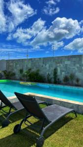 The swimming pool at or close to Village dos Coqueirais