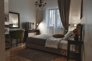 Postel nebo postele na pokoji v ubytování Garni hotel BARUT
