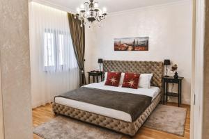 Postel nebo postele na pokoji v ubytování Garni hotel BARUT