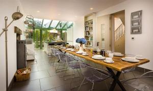 a large dining room with a long table and chairs at The Boundary in Windermere