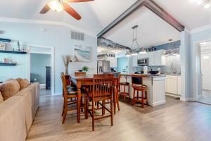 a kitchen and living room with a table and chairs at The Sand Dune in Ocean City