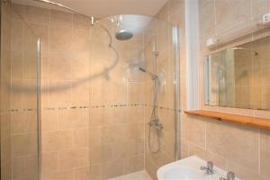 a bathroom with a shower and a sink at Yew Tree Cottage in Ambleside +7 photos