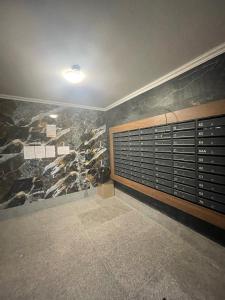 a room with a rock wall and a room with at Beautiful Apartment in Chisinau in Chişinău