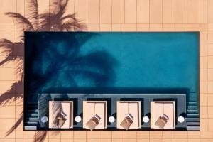 a blue sign on the side of a building at Kimpton Mas Olas Resort and Spa, an IHG Hotel in El Pescadero