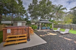 a backyard with a gazebo and a playground at Beachy Palm Harbor Escape Swim Spa Pool and Gazebo in Palm Harbor