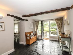 a living room with a couch and a table at The Mews in Ambleside