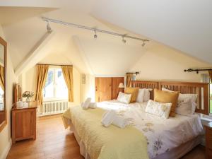 Highbeck Cottage tesisinde bir odada yatak veya yataklar