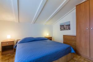 Posteľ alebo postele v izbe v ubytovaní Apartment Karigador 2534b