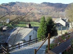 a view of a village with mountains in the background at White Lion Cottage in Chapel Stile +4 photos