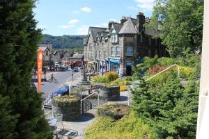 a small town with houses and a street with a street at Over Ghyll in Ambleside