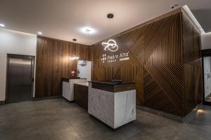 a hotel lobby with a sign on the wall at Hoteles Piedra Alta by De Los Perez in San Andrés Tuxtla