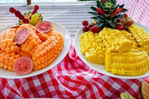 two plates of corn and vegetables on a table at La Martina Campestre in Rionegro